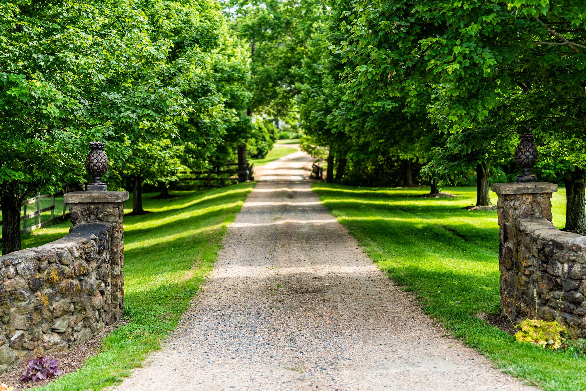 gated-open-entrance-with-road-driveway-in-rural-countryside